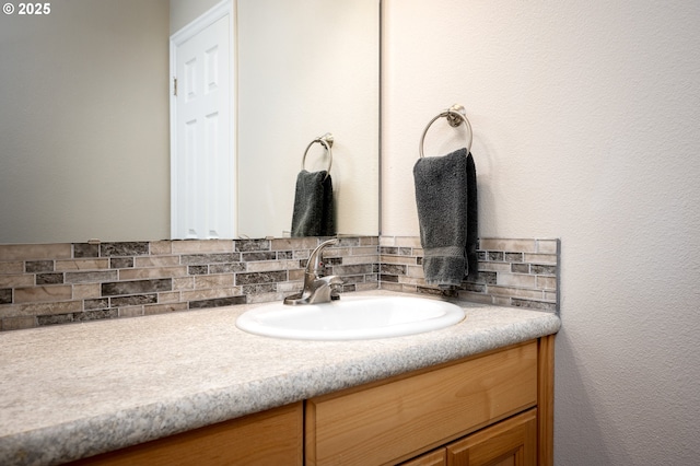 bathroom with vanity and backsplash