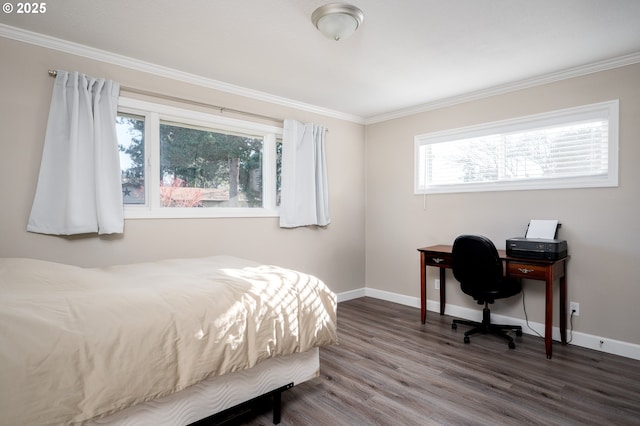 bedroom with ornamental molding, wood finished floors, and baseboards