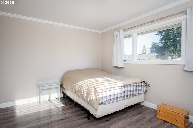 bedroom with crown molding and dark wood-type flooring