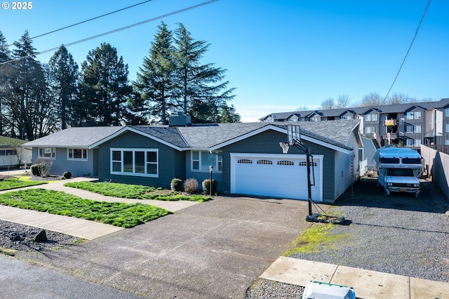 view of front of home with aphalt driveway and an attached garage