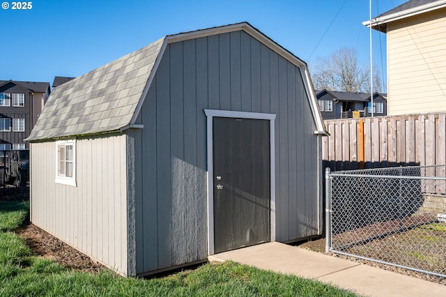 view of shed with fence