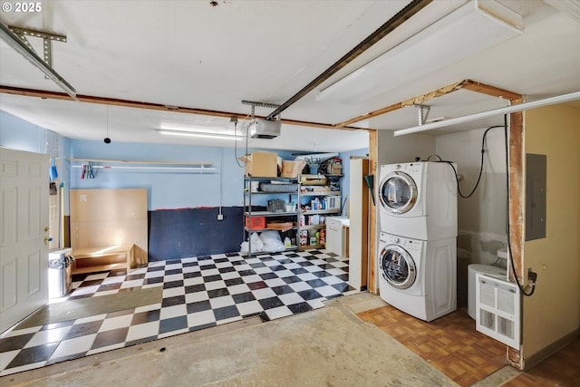 419 State St, Lyle, WA 98635 - laundry room with a garage, stacked washer / drying machine, laundry area, and tile patterned floors