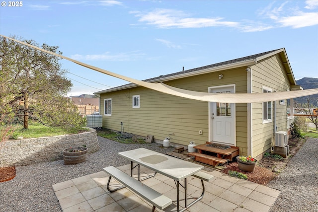 419 State St, Lyle, WA 98635 - rear view of house featuring fence and a patio area
