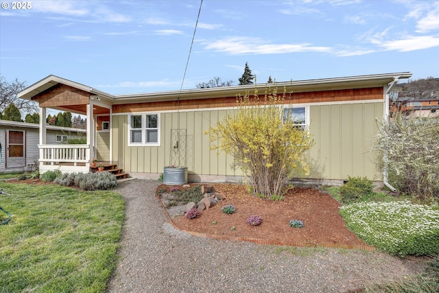 419 State St, Lyle, WA 98635 - view of front of property featuring covered porch, board and batten siding, and a front yard