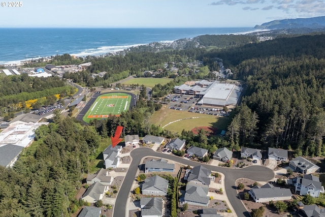 4145 SE Inlet Ave, Lincoln City, OR 97367 - aerial overview of property's location featuring a heavily wooded area, a large body of water, and nearby suburban area