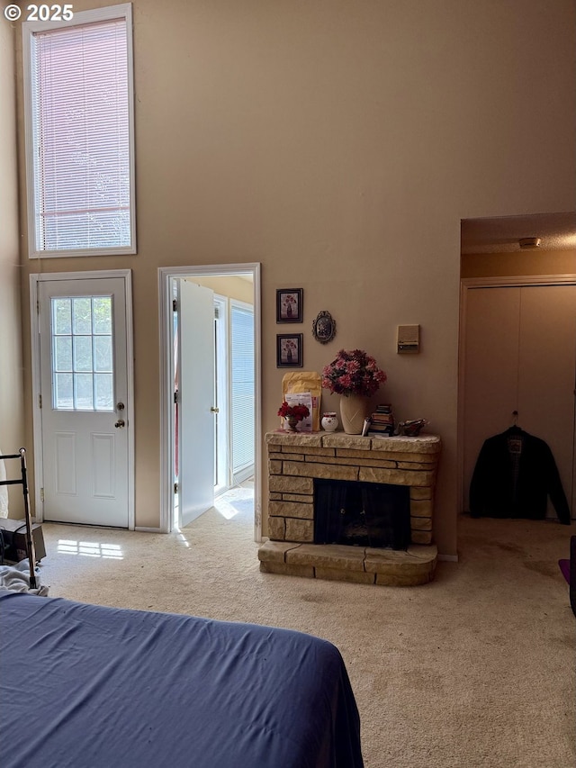 275 NE Scott Dr, Gresham, OR 97030 - bedroom with a high ceiling, carpet floors, and a stone fireplace