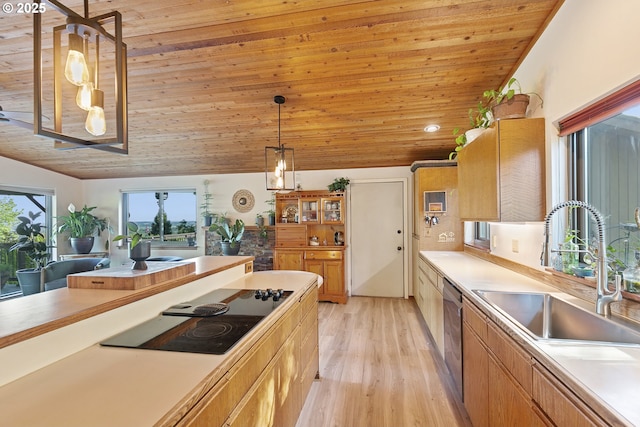 kitchen featuring a sink, light wood-style floors, light countertops, black electric cooktop, and wood ceiling