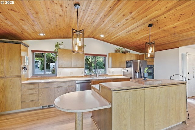 kitchen with a sink, light wood-style floors, stainless steel appliances, vaulted ceiling, and wood ceiling