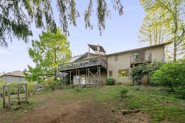 back of property with a wooden deck