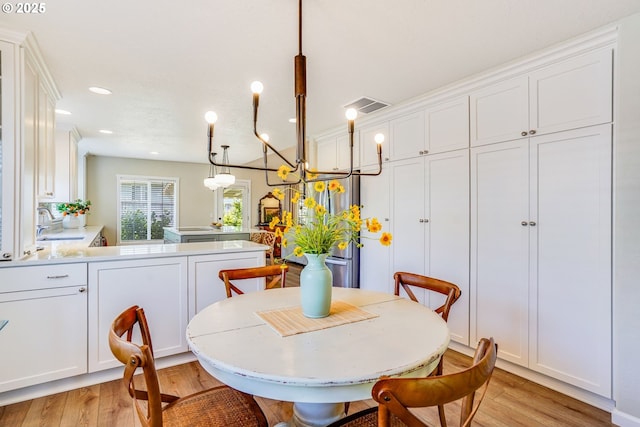 603 Lone Oaks Loop, Silverton, OR 97381 - dining room with light wood-style flooring, recessed lighting, and a chandelier