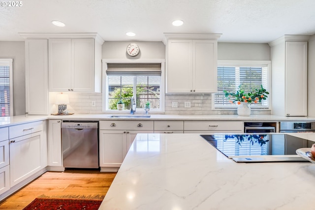 603 Lone Oaks Loop, Silverton, OR 97381 - kitchen with dishwasher, white cabinets, tasteful backsplash, black electric cooktop, and recessed lighting