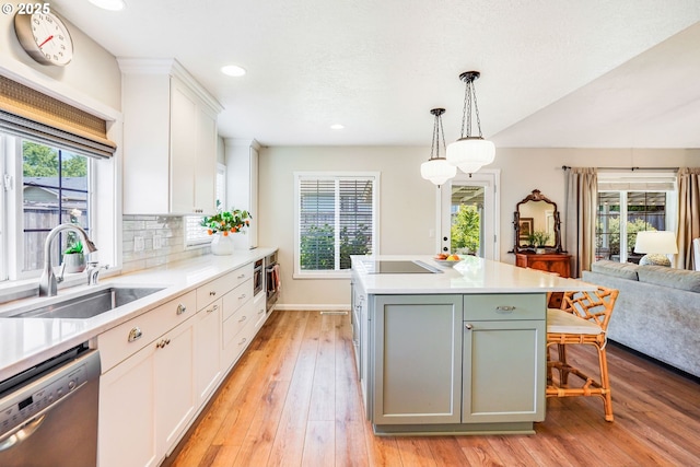 603 Lone Oaks Loop, Silverton, OR 97381 - kitchen featuring dishwasher, healthy amount of natural light, light wood-type flooring, white cabinets, and recessed lighting