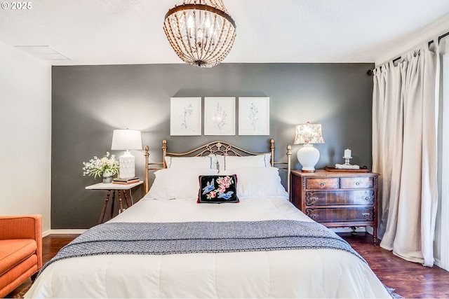 603 Lone Oaks Loop, Silverton, OR 97381 - bedroom with dark wood finished floors and a chandelier