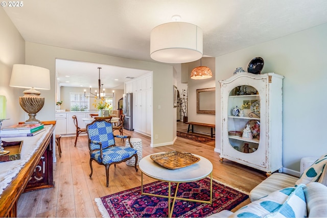 603 Lone Oaks Loop, Silverton, OR 97381 - living room with a chandelier and light wood-style flooring
