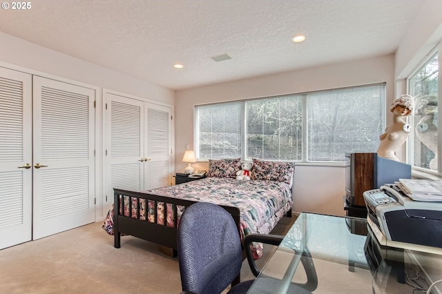8408 NW Pinnacle Ct, Portland, OR 97229 - bedroom with multiple closets, carpet flooring, and recessed lighting