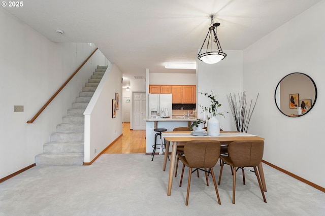 view of carpeted dining space