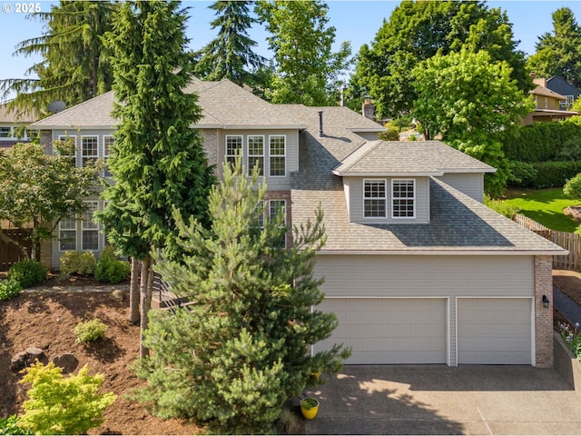 6783 Apollo Rd, West Linn, OR 97068 - view of front facade with driveway, roof with shingles, brick siding, and a chimney