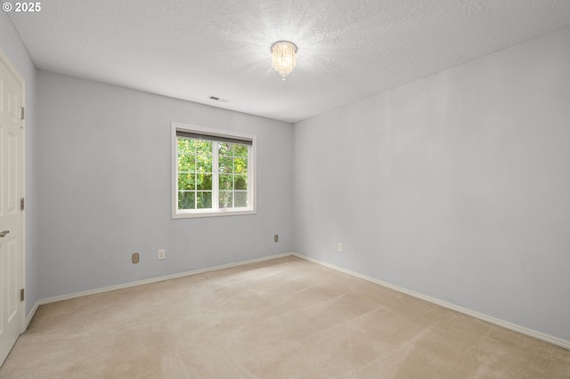 6783 Apollo Rd, West Linn, OR 97068 - spare room with light colored carpet, a textured ceiling, and baseboards