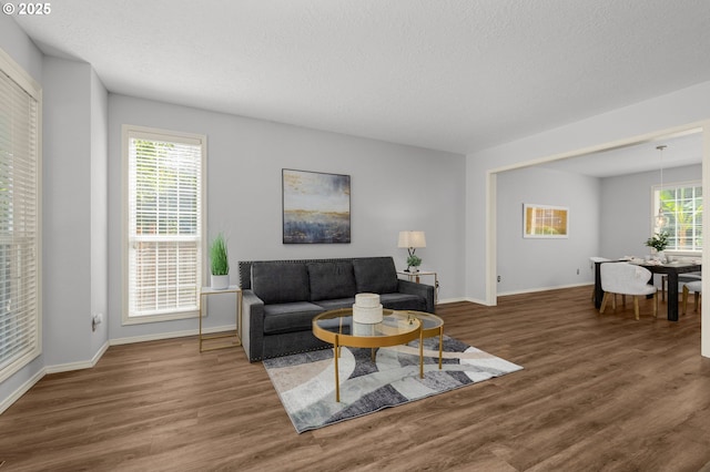 6783 Apollo Rd, West Linn, OR 97068 - living room with wood finished floors, baseboards, and a textured ceiling