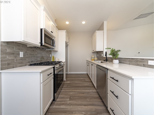 2368 Kingwood St, Forest Grove, OR 97116 - kitchen with visible vents, appliances with stainless steel finishes, light countertops, white cabinetry, and a sink