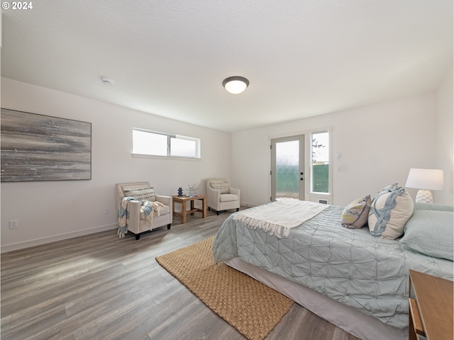 2368 Kingwood St, Forest Grove, OR 97116 - bedroom with access to exterior, multiple windows, baseboards, and wood finished floors