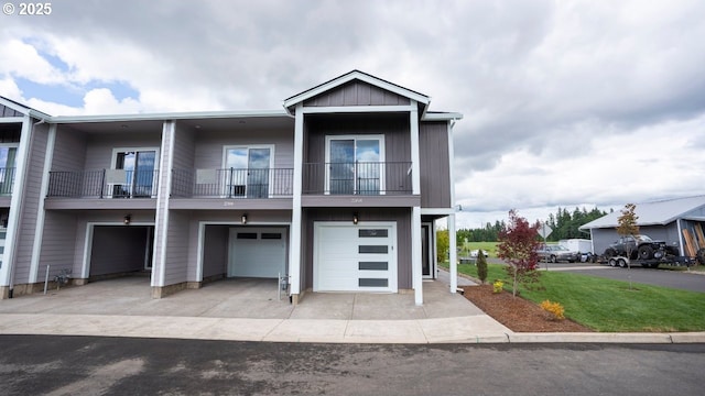 2368 Kingwood St, Forest Grove, OR 97116 - view of front facade featuring a garage, a balcony, and driveway