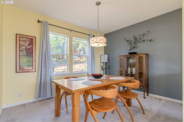 dining area with light carpet