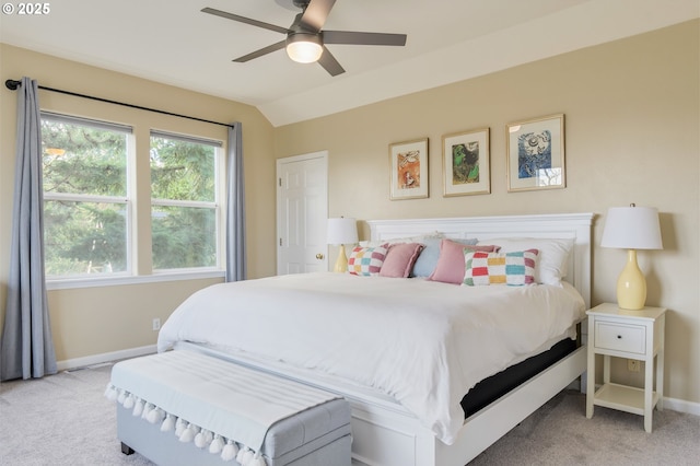 bedroom with ceiling fan, light carpet, and lofted ceiling