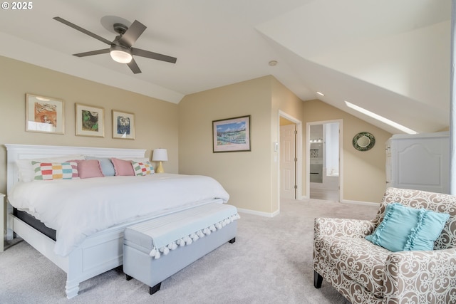 bedroom with vaulted ceiling with skylight, ceiling fan, and light colored carpet