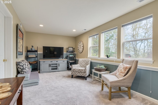 living area with light colored carpet