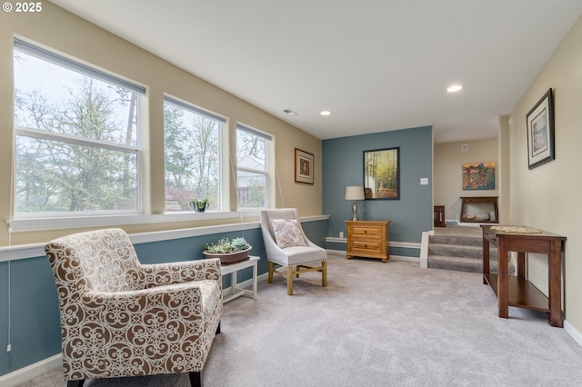 sitting room featuring carpet flooring