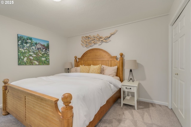 carpeted bedroom featuring a closet