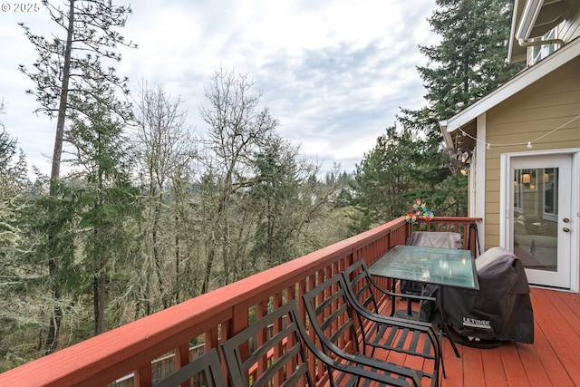 wooden deck with grilling area