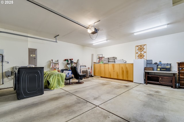 garage with a garage door opener and electric panel