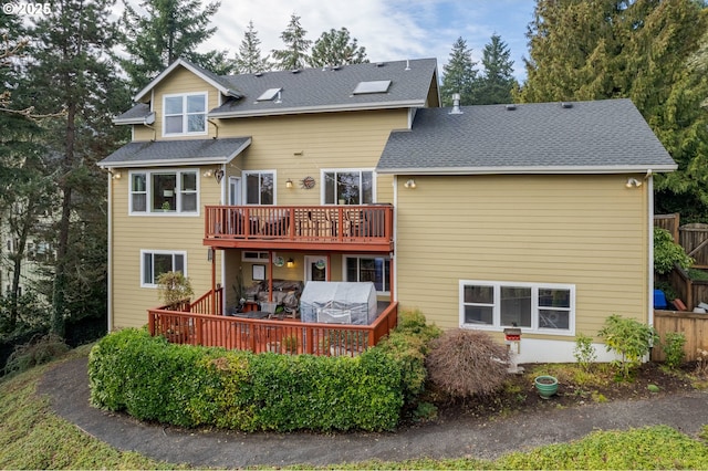 back of house with a wooden deck