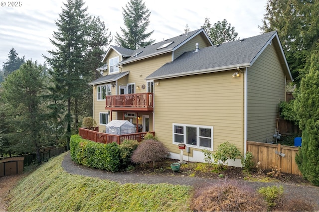 rear view of house with a deck