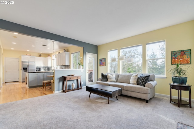 living room with light colored carpet