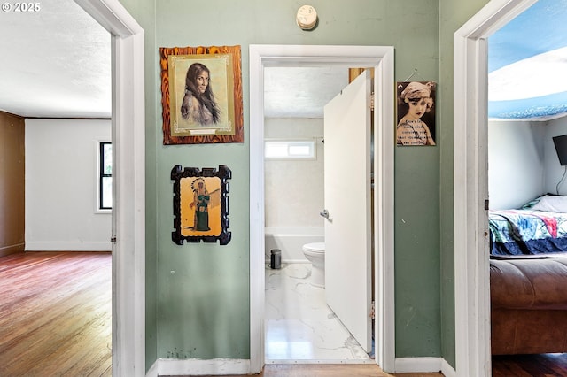 36285 Row River Rd, Cottage Grove, OR 97424 - hallway featuring baseboards and wood finished floors