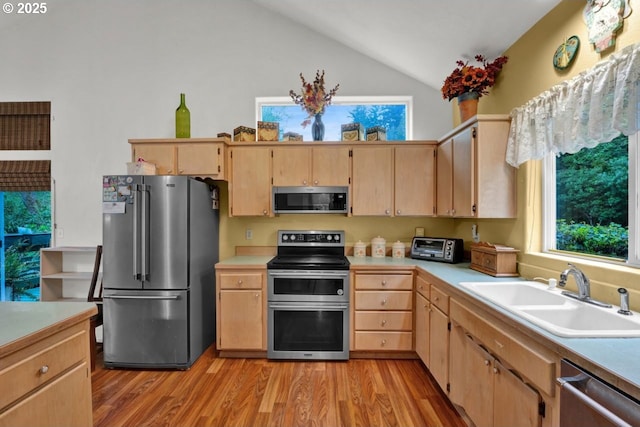 3347 31st St, Florence, OR 97439 - kitchen featuring a sink, appliances with stainless steel finishes, lofted ceiling, and light brown cabinets