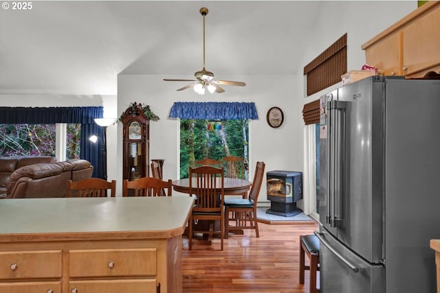 3347 31st St, Florence, OR 97439 - kitchen with a ceiling fan, high end fridge, plenty of natural light, and wood finished floors
