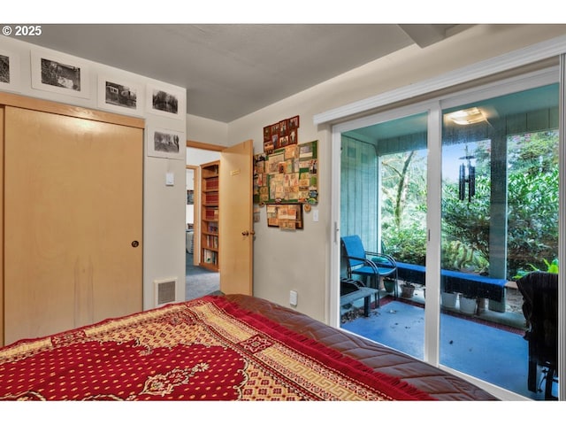 bedroom with visible vents, carpet flooring, multiple windows, and access to exterior