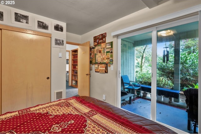 3347 31st St, Florence, OR 97439 - bedroom with visible vents, carpet flooring, multiple windows, and access to exterior