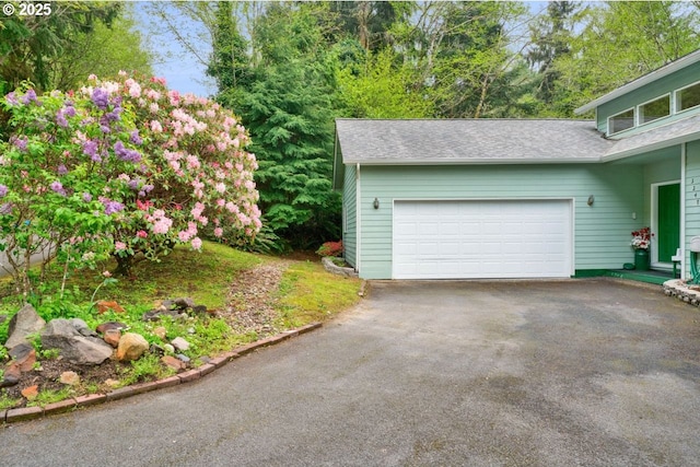 3347 31st St, Florence, OR 97439 - garage with aphalt driveway