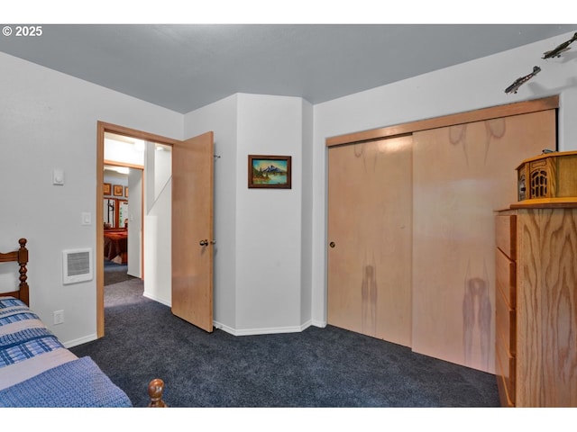 unfurnished bedroom with carpet floors, baseboards, a closet, and visible vents