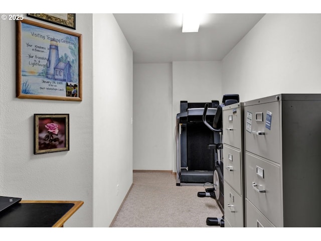 home office featuring baseboards and carpet
