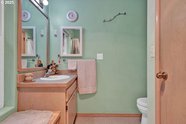 3347 31st St, Florence, OR 97439 - bathroom with toilet, baseboards, and vanity