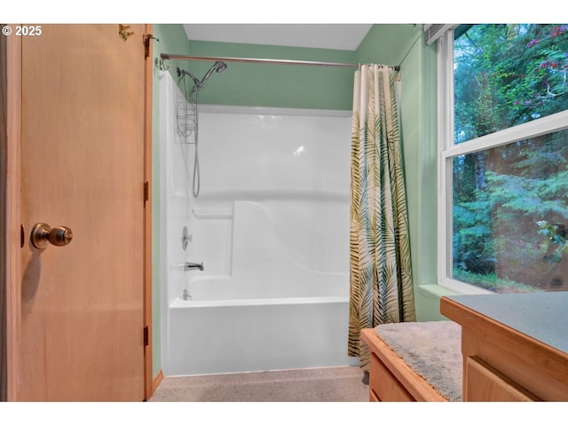 full bathroom with vanity and shower / tub combo with curtain