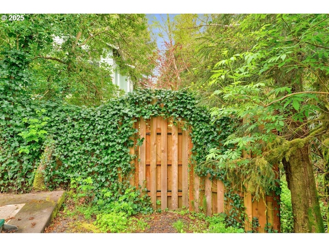 view of outdoor structure with fence