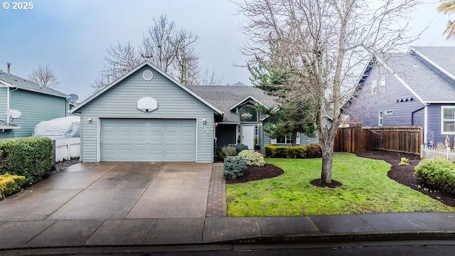 view of front facade featuring driveway, an attached garage, fence, and a front lawn