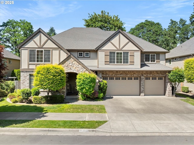 4123 Chad Dr, Lake Oswego, OR 97034 - english style home with an attached garage, stone siding, concrete driveway, and stucco siding